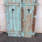 Pair of green wooden shutters