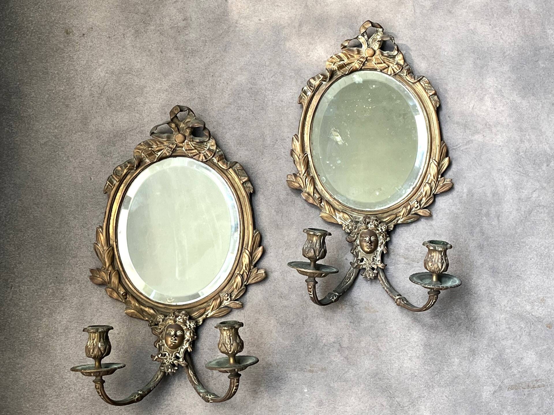 Pair of mirror sconces with bronze candlesticks from the 19th century.