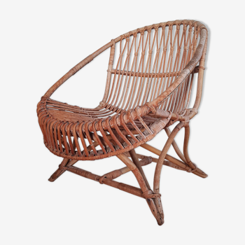 Vintage rattan armchair original shell shape