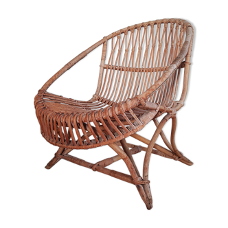 Vintage rattan armchair original shell shape