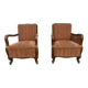 Pair of 1920s brown armchairs in carved wood and fabric, with caning detail.