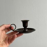 Small antique candle holder in patinated metal