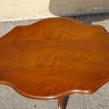 Violin-shaped pedestal table
