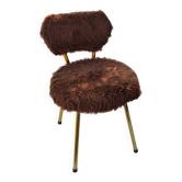 Vintage shaggy chair in faux fur with golden metal legs.