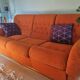 A lot of orange seventies sofas and armchairs.