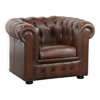 Great brown cowhide Chesterfield club armchair in English style