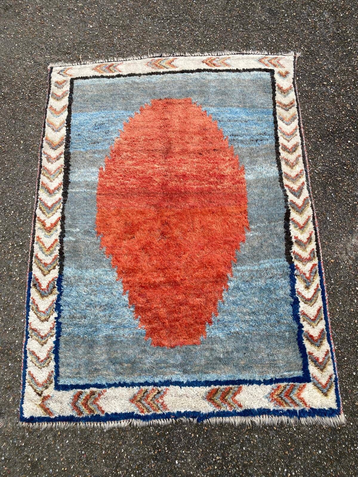 Handmade wool Berber rug with long pile, 110x150cm.