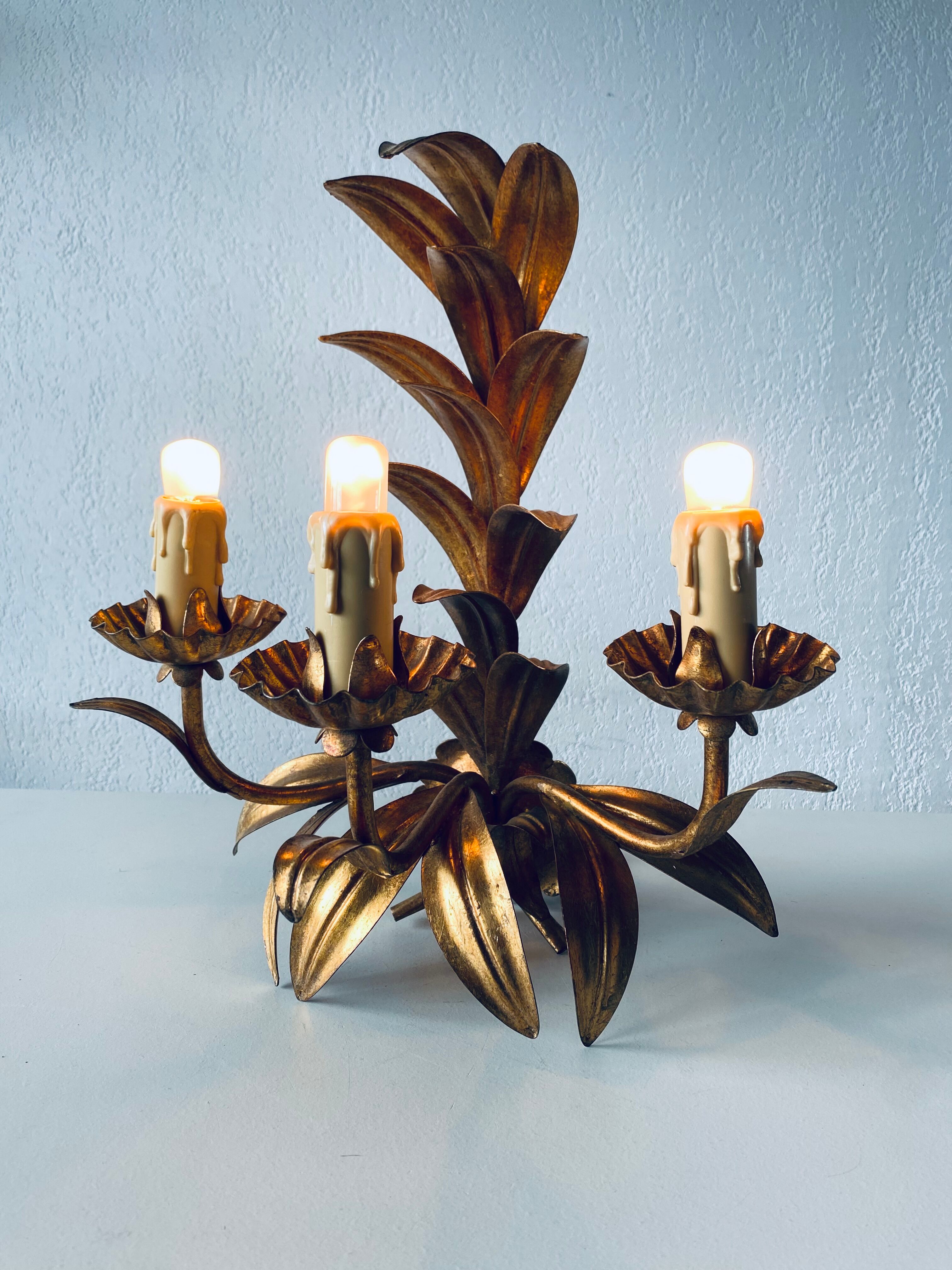 Golden leaf wall light