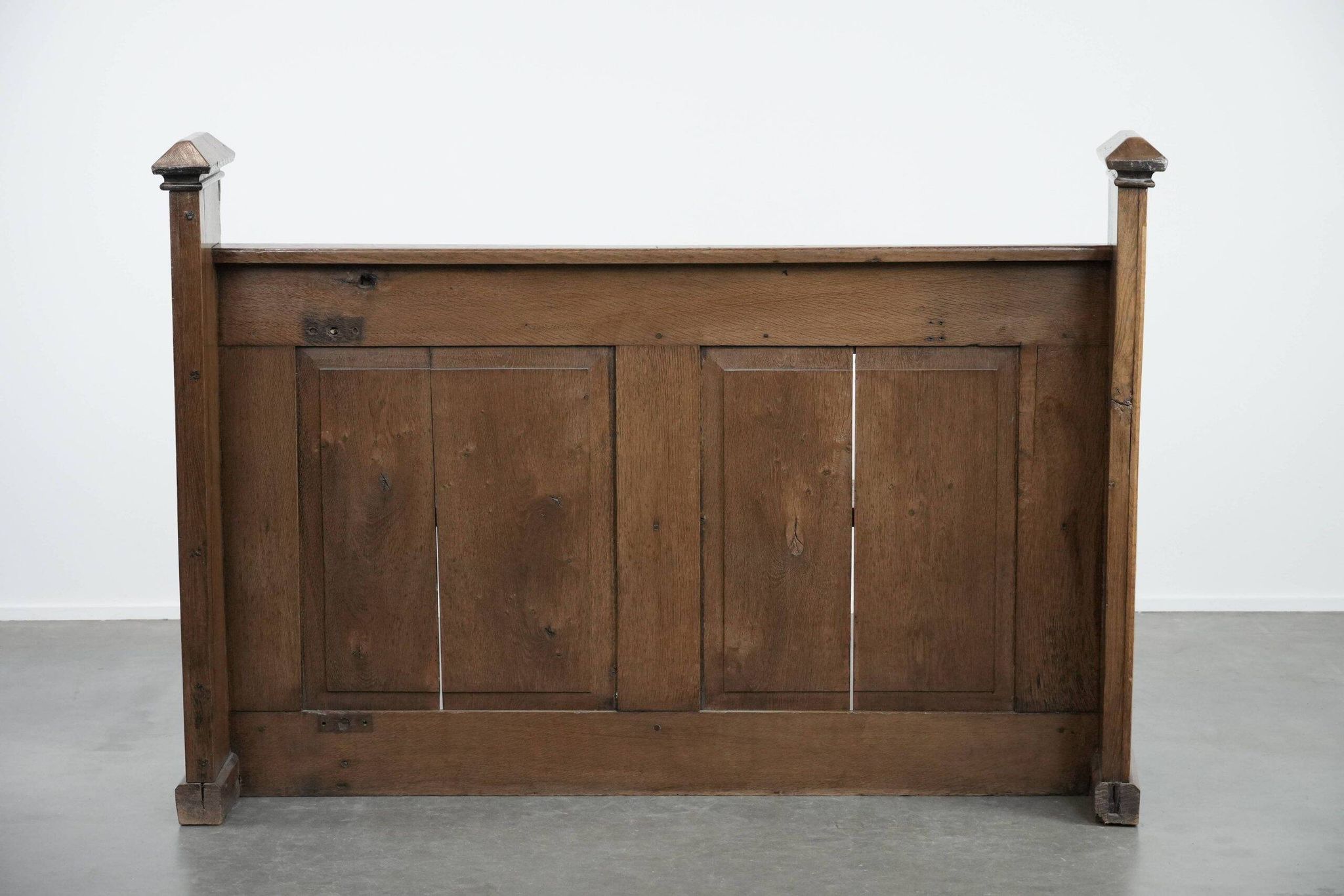 Antique oak church bench in Gothic style with beautiful wood carving