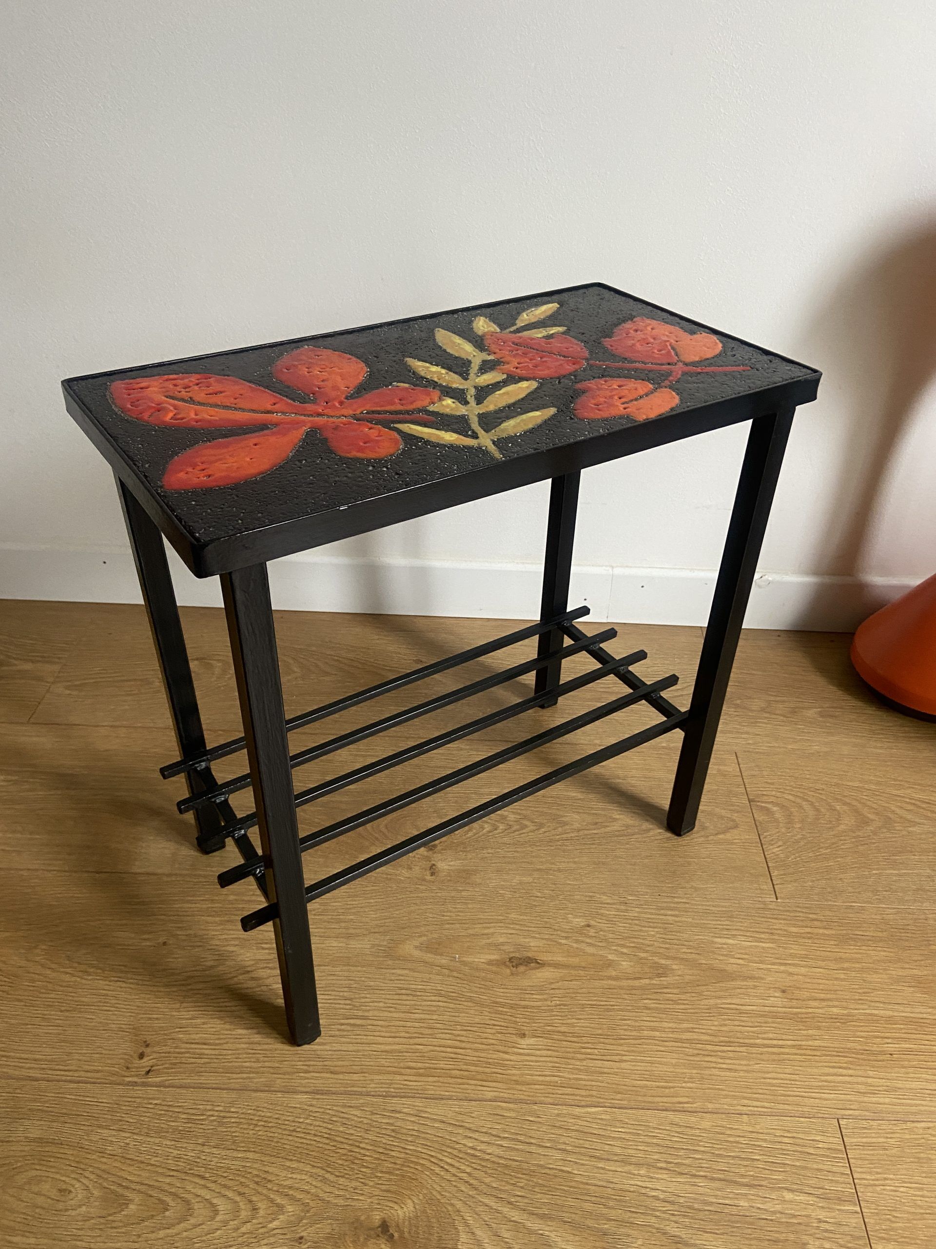 Side table or end of sofa in wrought iron and enamelled lava stone circa 1960