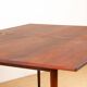 Danish extendable dining table in rosewood and brass by Poul Volther