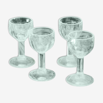 Four vintage shot glasses