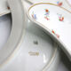 Ravier lune aux motifs de fleurs et liseré or en porcelaine de Limoges