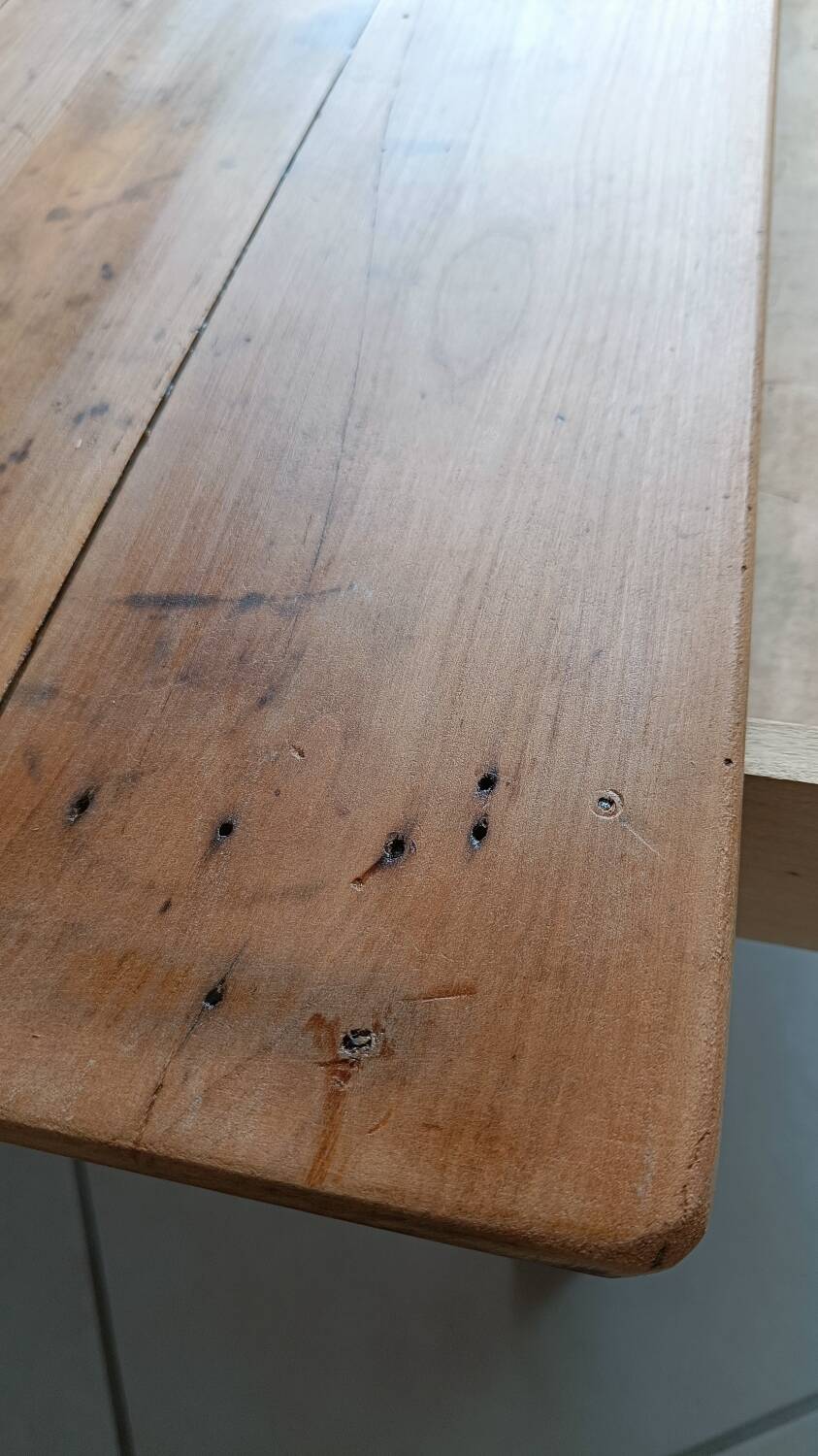 Coffee table with raw wood and a large drawer.