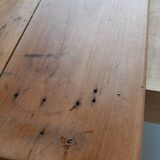 Coffee table with raw wood and a large drawer.