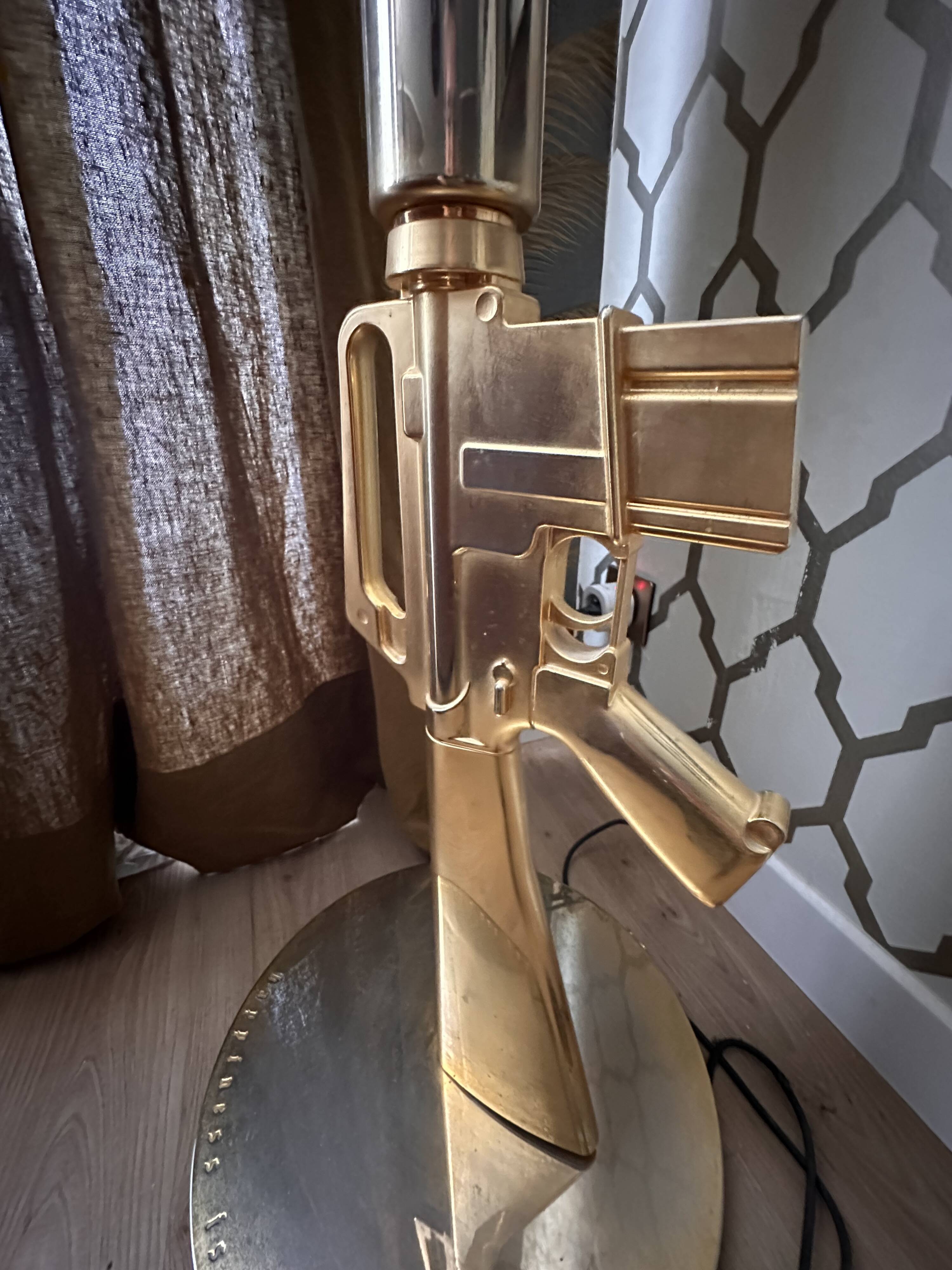 "Lounge Gun" floor lamp by FLOS by Philippe Starck – Gold