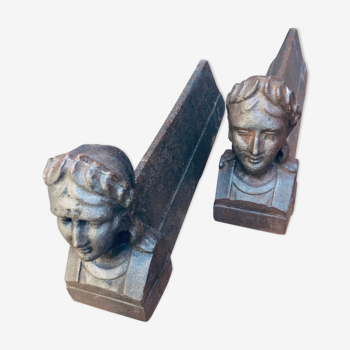 Pair of cast-iron chenet characters with laurels