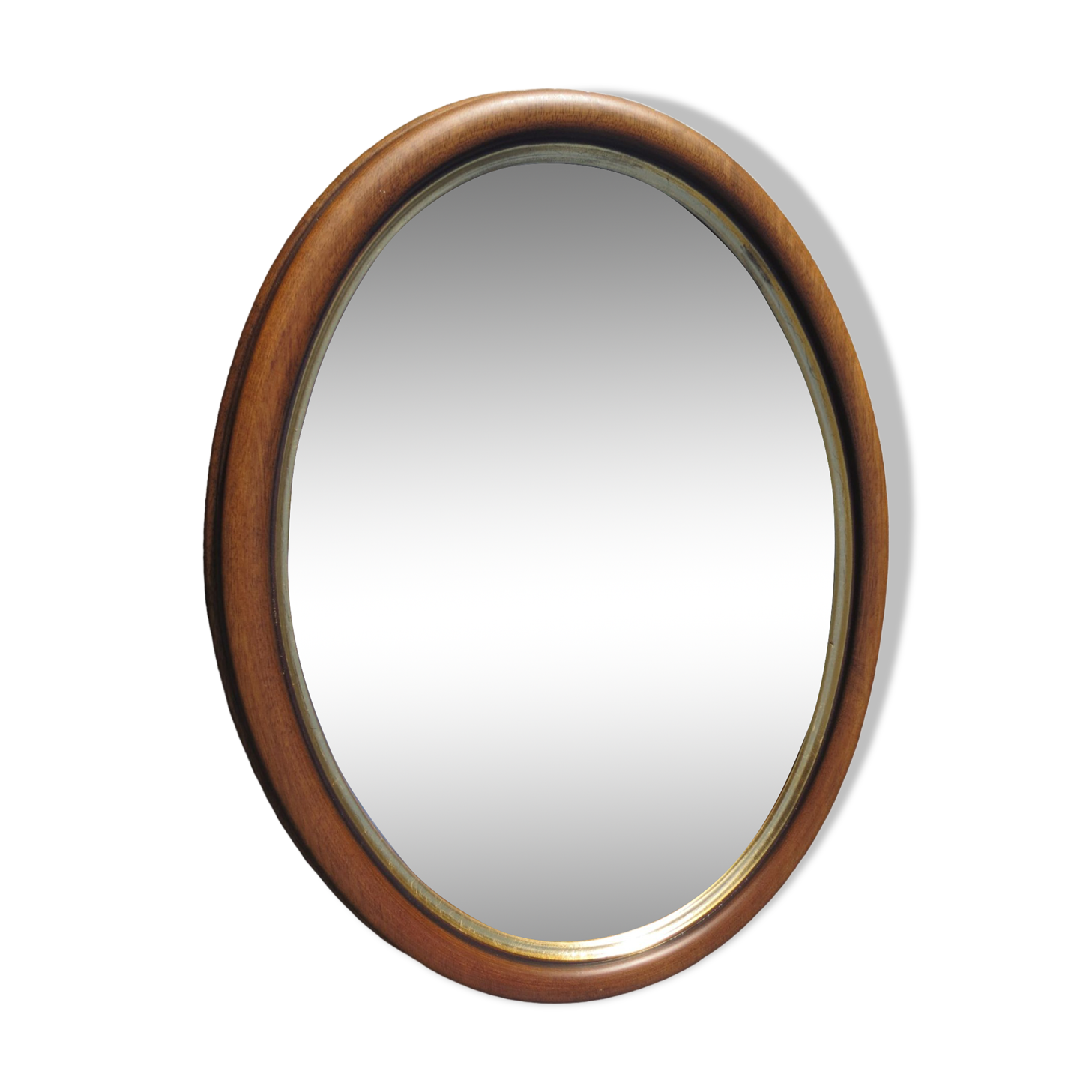 Old oval mirror, walnut wood tower, gilded border