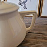 Vintage round ceramic teapot in cream colour, art deco style.