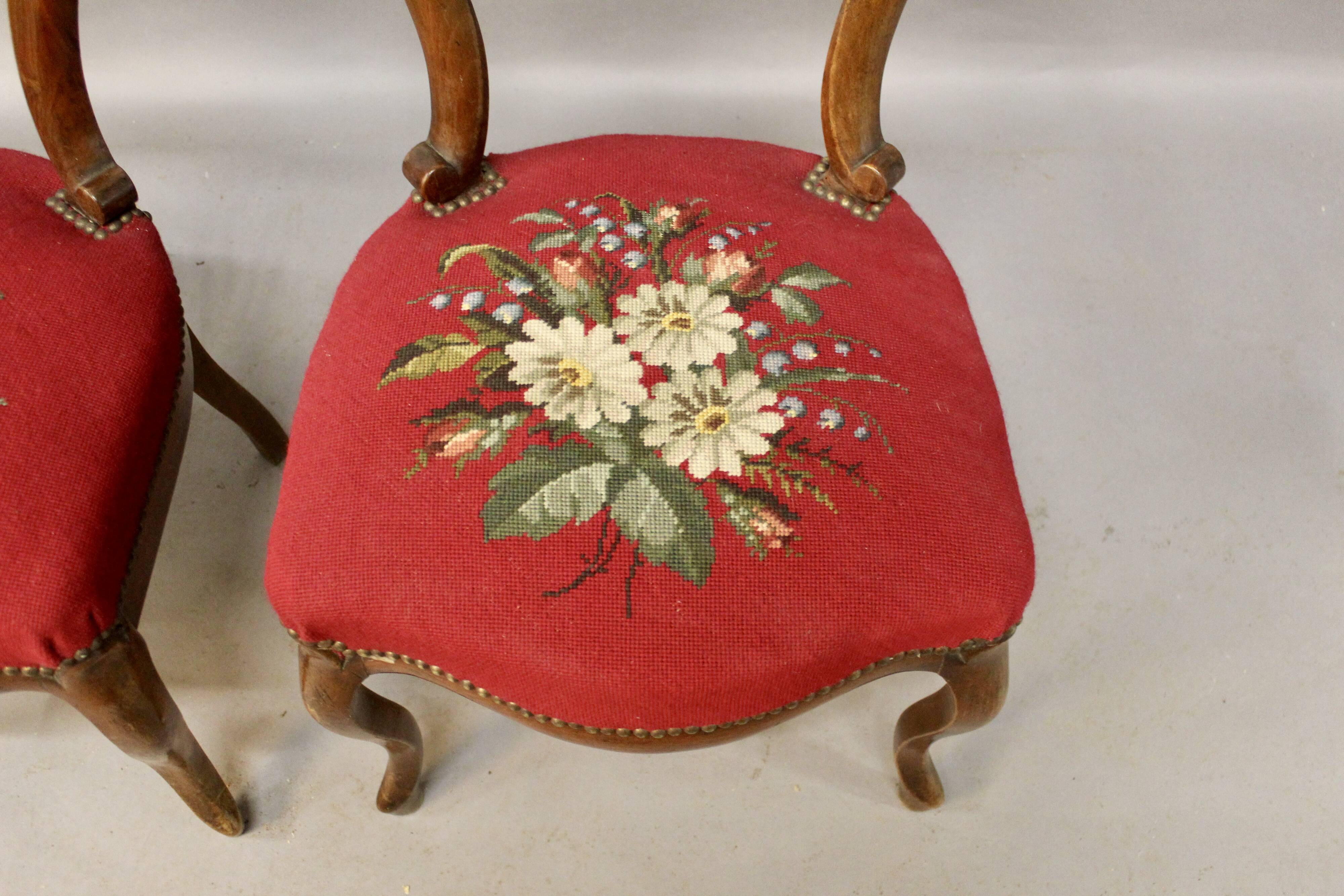 Pair of Louis Philippe walnut chairs, petit point tapestry
