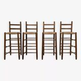 Set of 4 50s bar stools in wood and woven straw seat