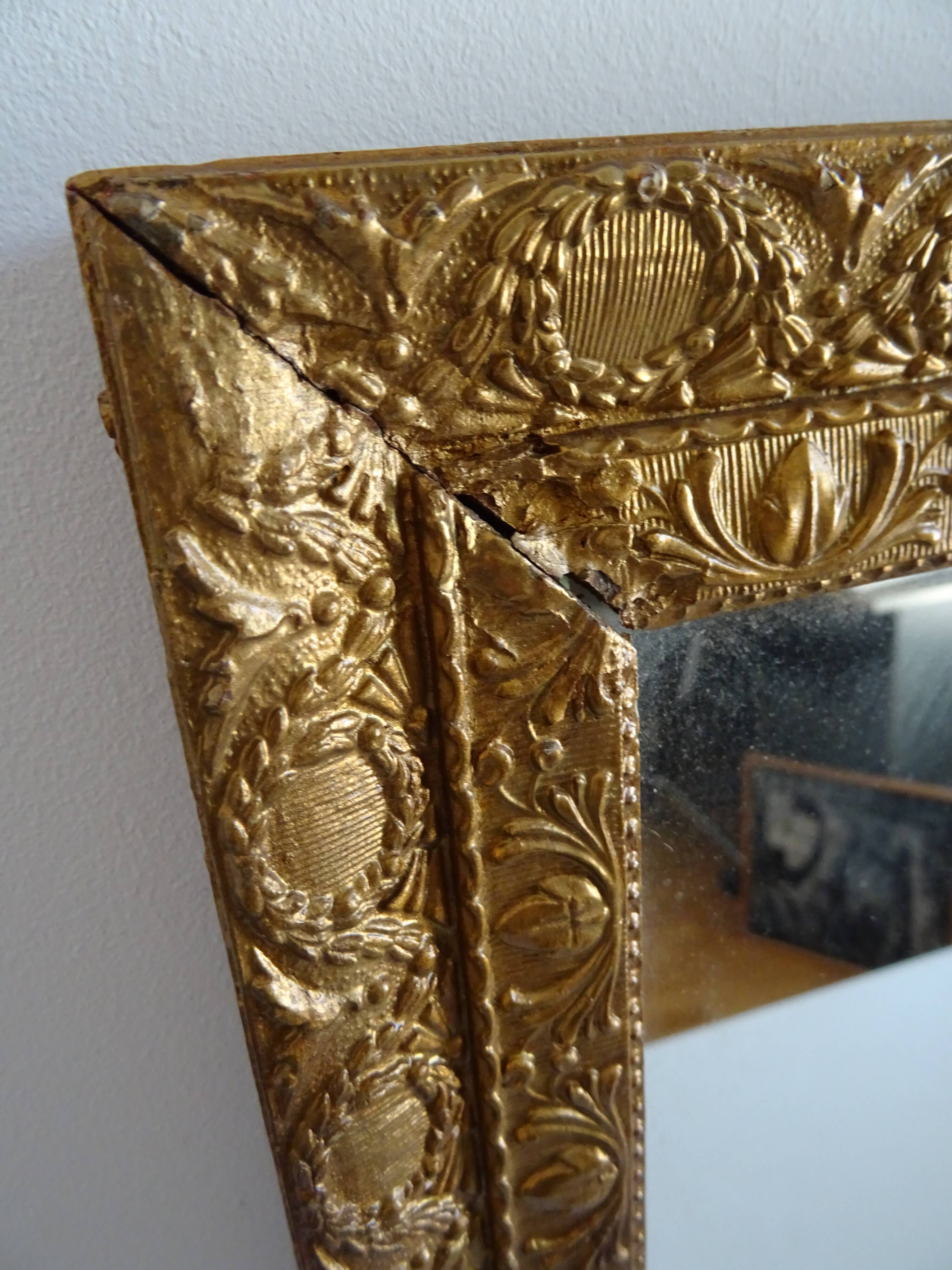Wood and gilded stucco wall mirror