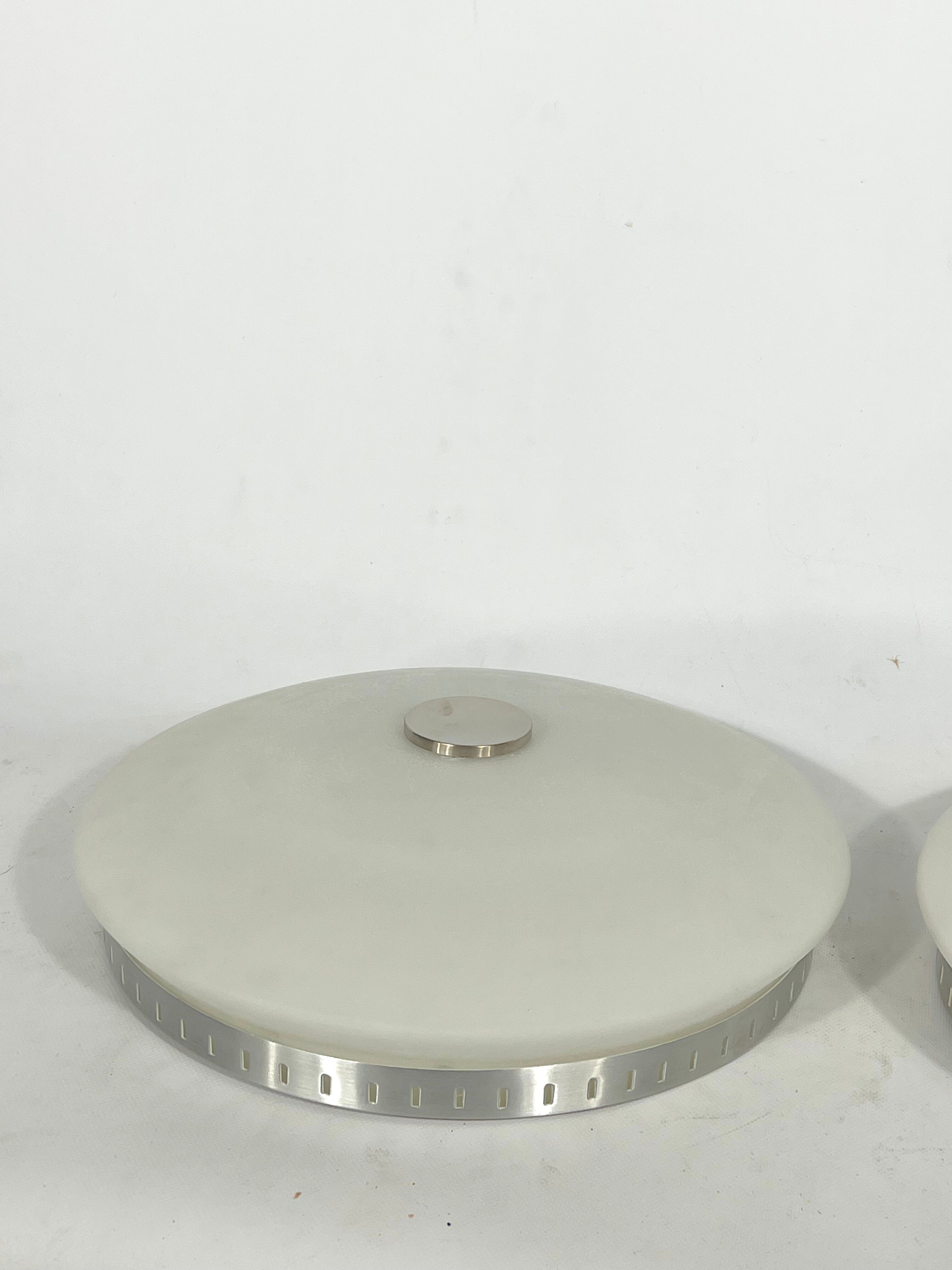 Stilux Milano, pair of round opaline glass ceiling lamps. 1960s