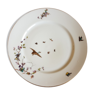 Assiette en porcelaine de Limoges à décor d'oiseaux