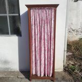 Old wardrobe in old wood and vintage fabric