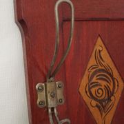Red wooden wall-mounted coat rack and Art Deco mirror