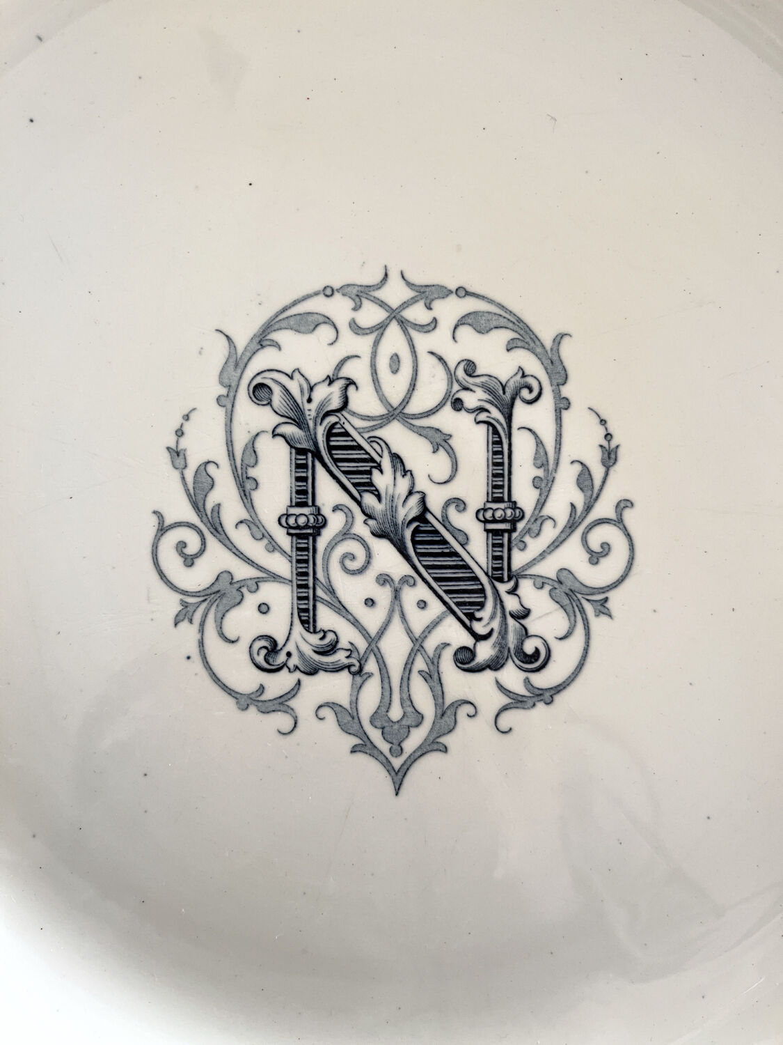 Round iron earth dish monogram “N” KG Lunéville
