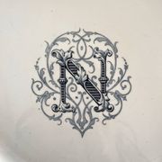 Round iron earth dish monogram “N” KG Lunéville