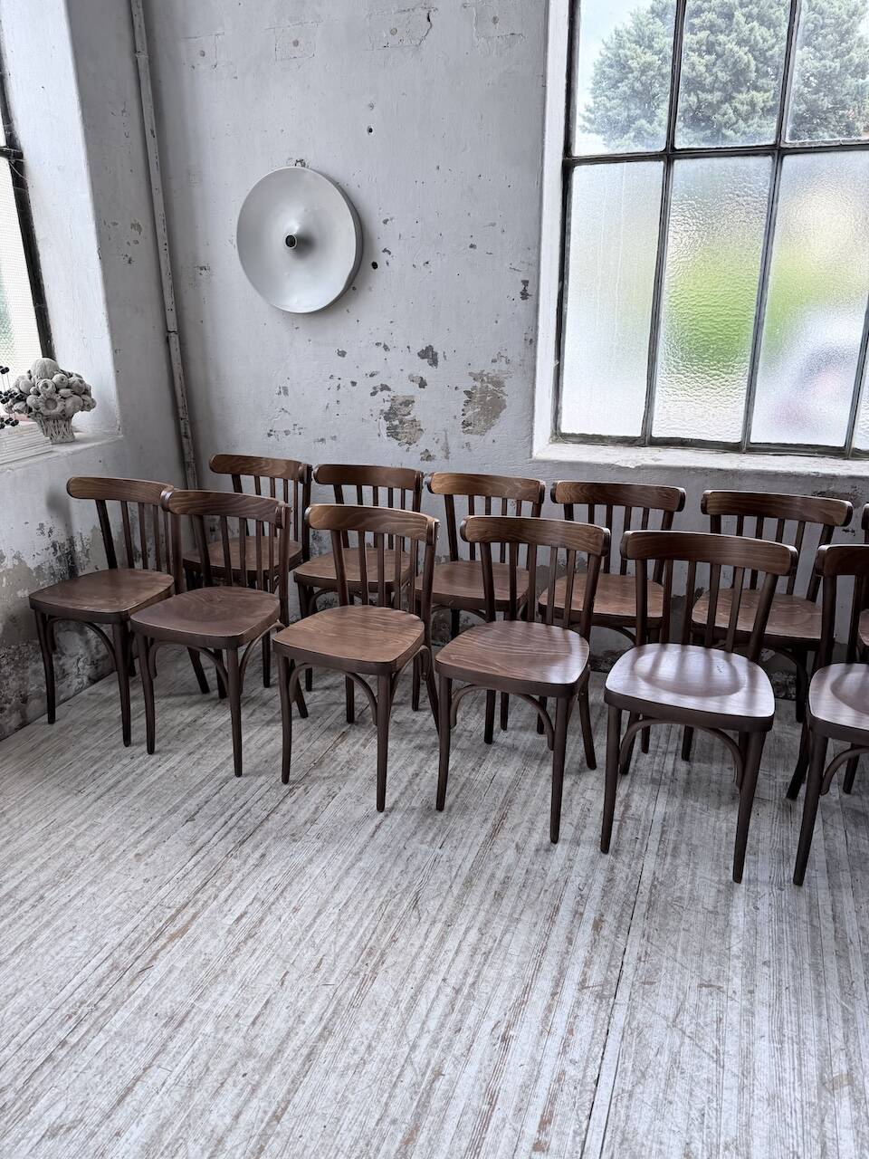 Set of 14 walnut bistro chairs.