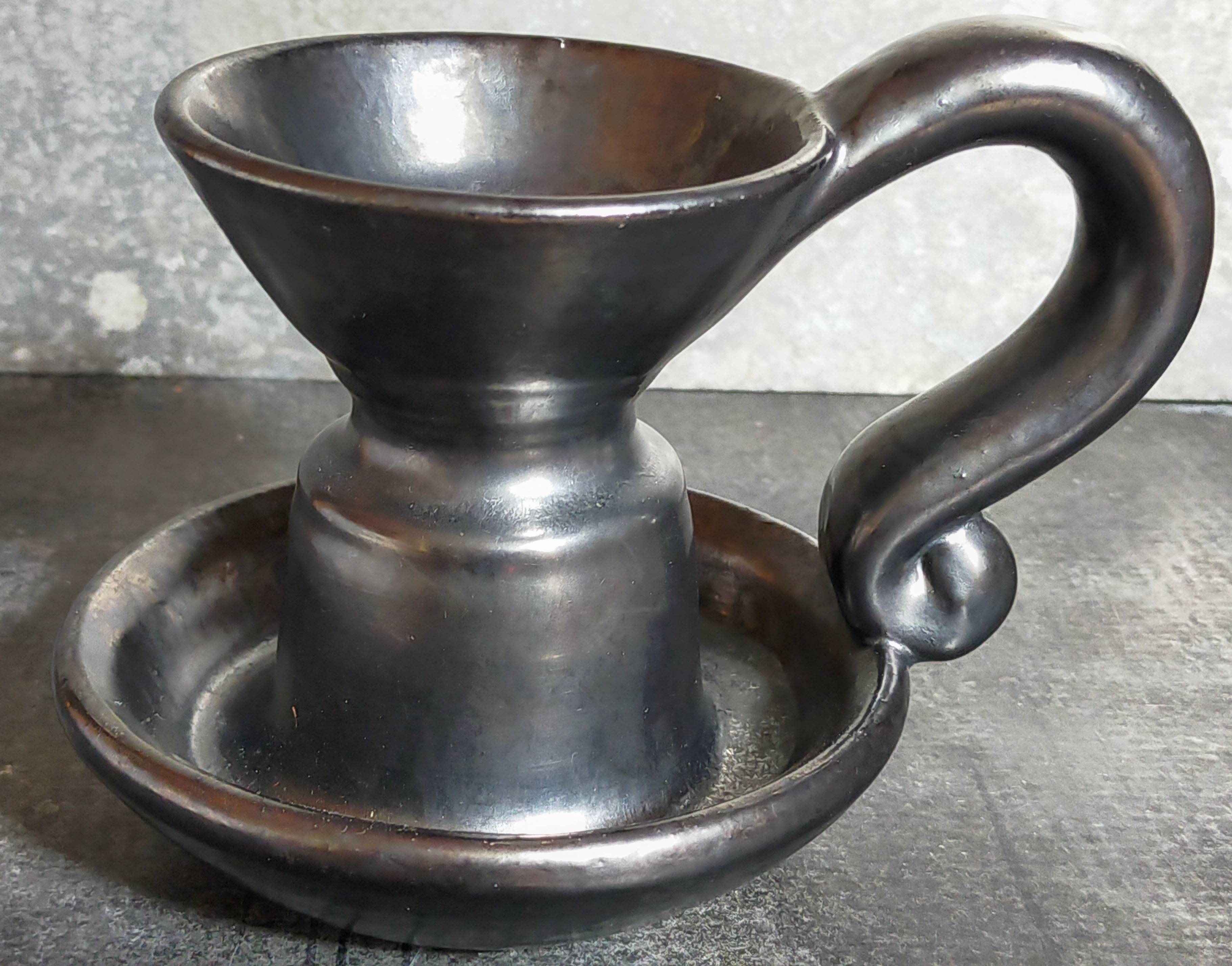 1950s iridescent black ceramic hand candle holder