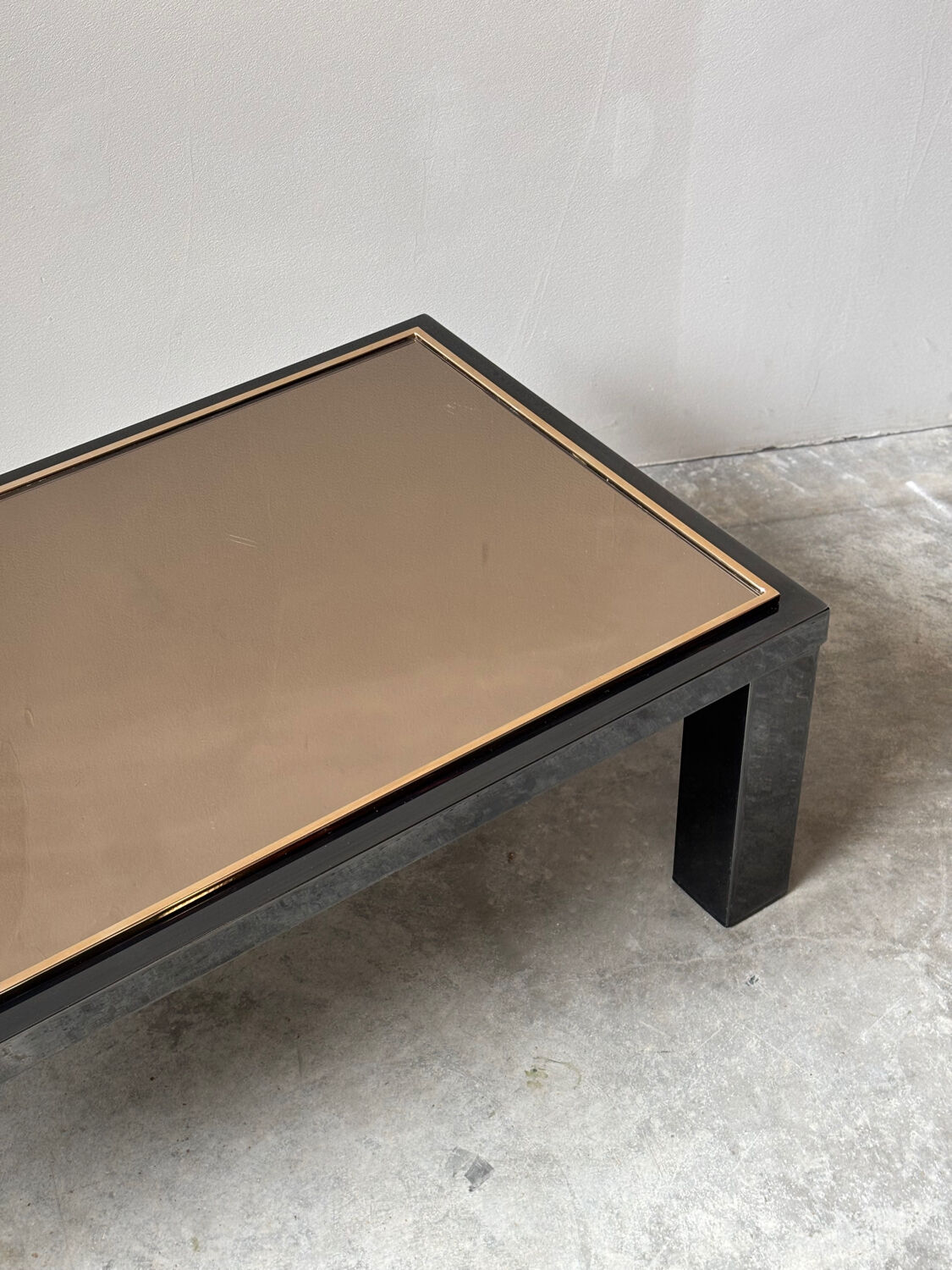 Large Belgochrom coffee table in gold and smoked glass.