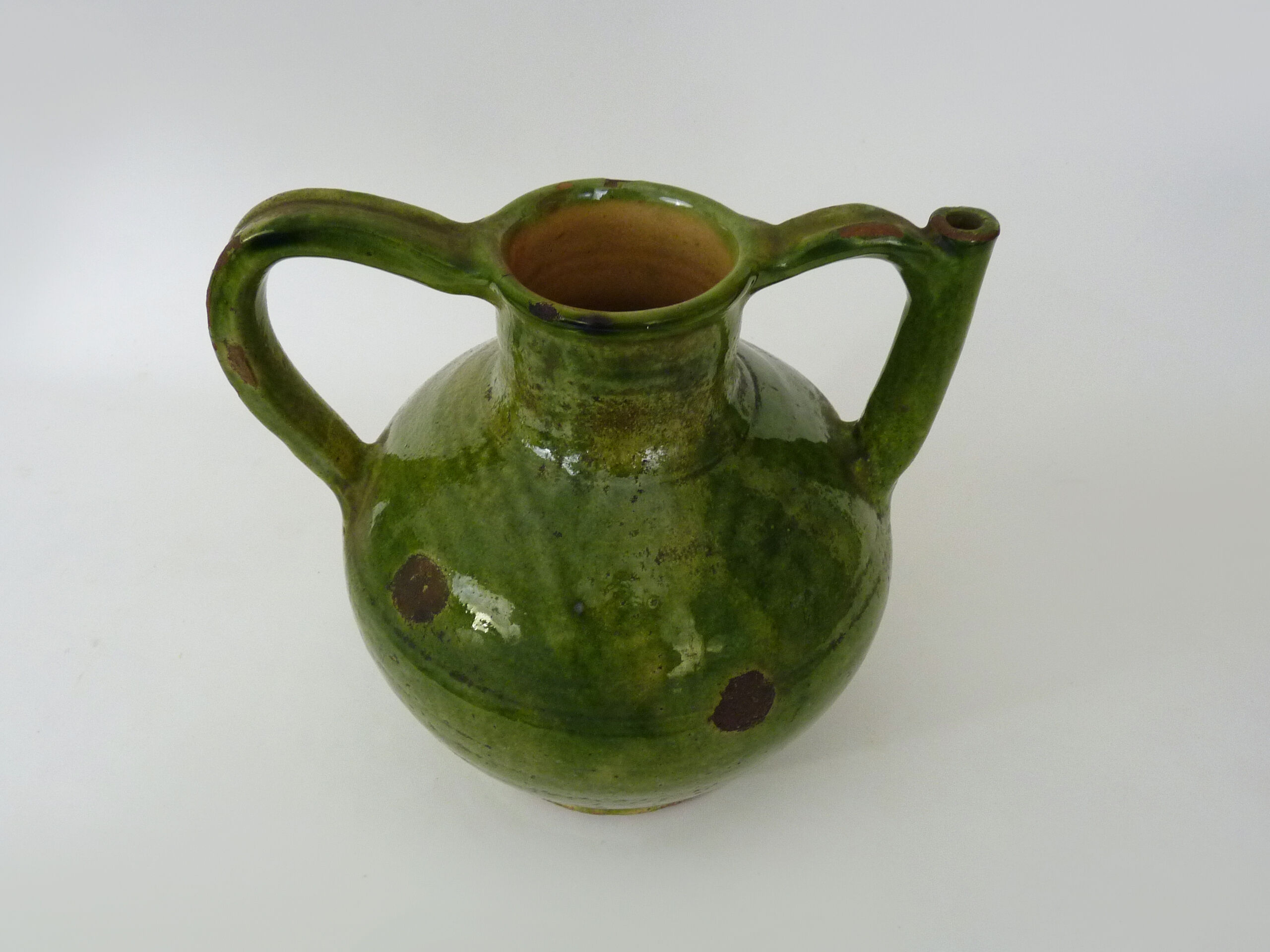Pitcher pottery in green glazed terracotta, south west of France. XIXth