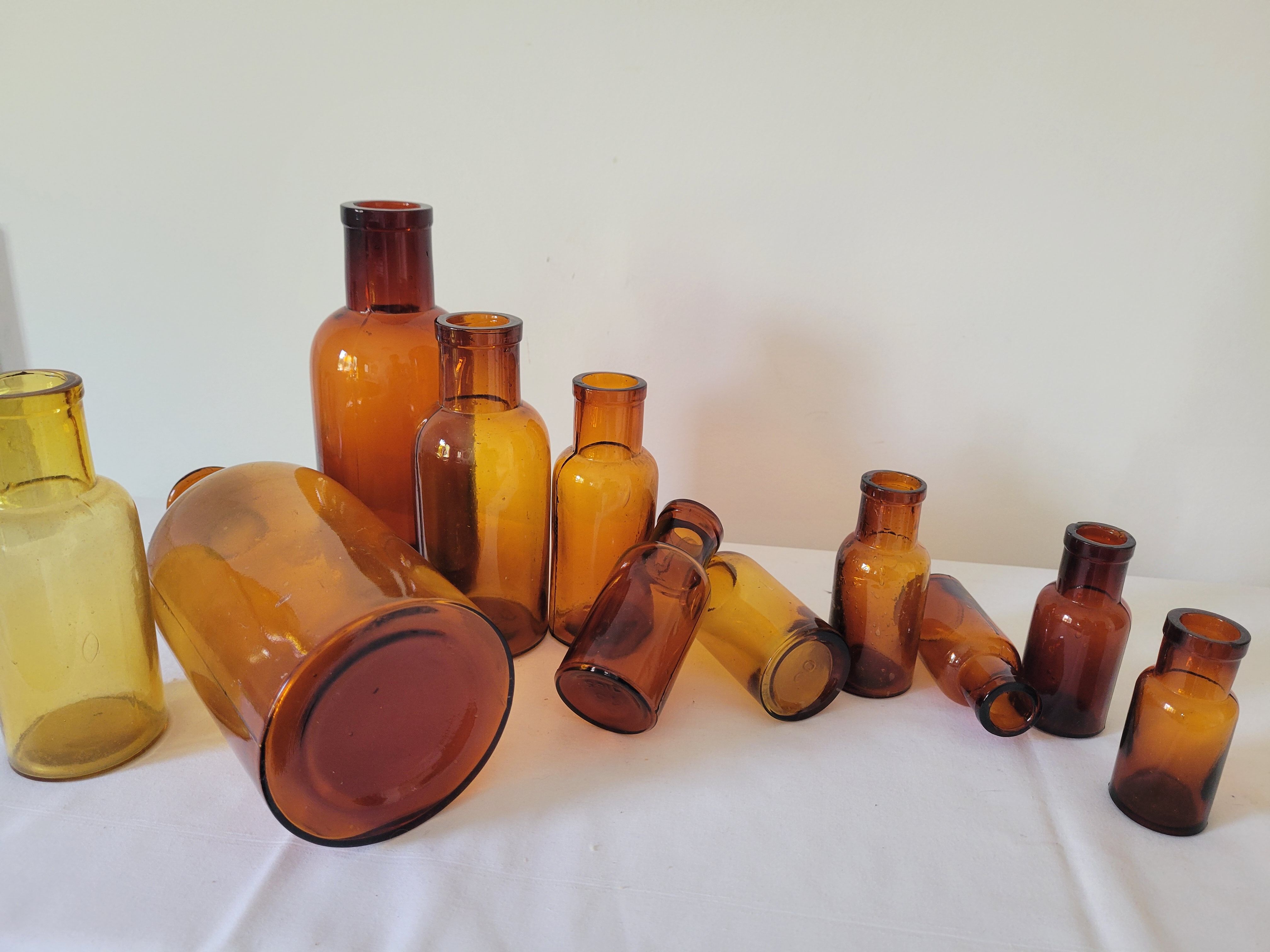 11 bottles of amber glass apothecary