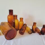 11 bottles of amber glass apothecary