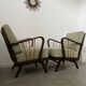 Set 2 old designer fireside chairs from the 50s wood and vintage fabric