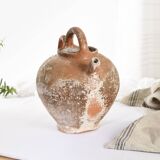 Old water jug. Gargoulette. Old terracotta pitcher.