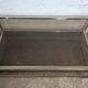 1970s coffee table in brass with a double smoked glass top.