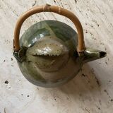 Handmade ceramic teapot with green fish and bamboo