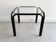 Vintage square black side table with a glass top