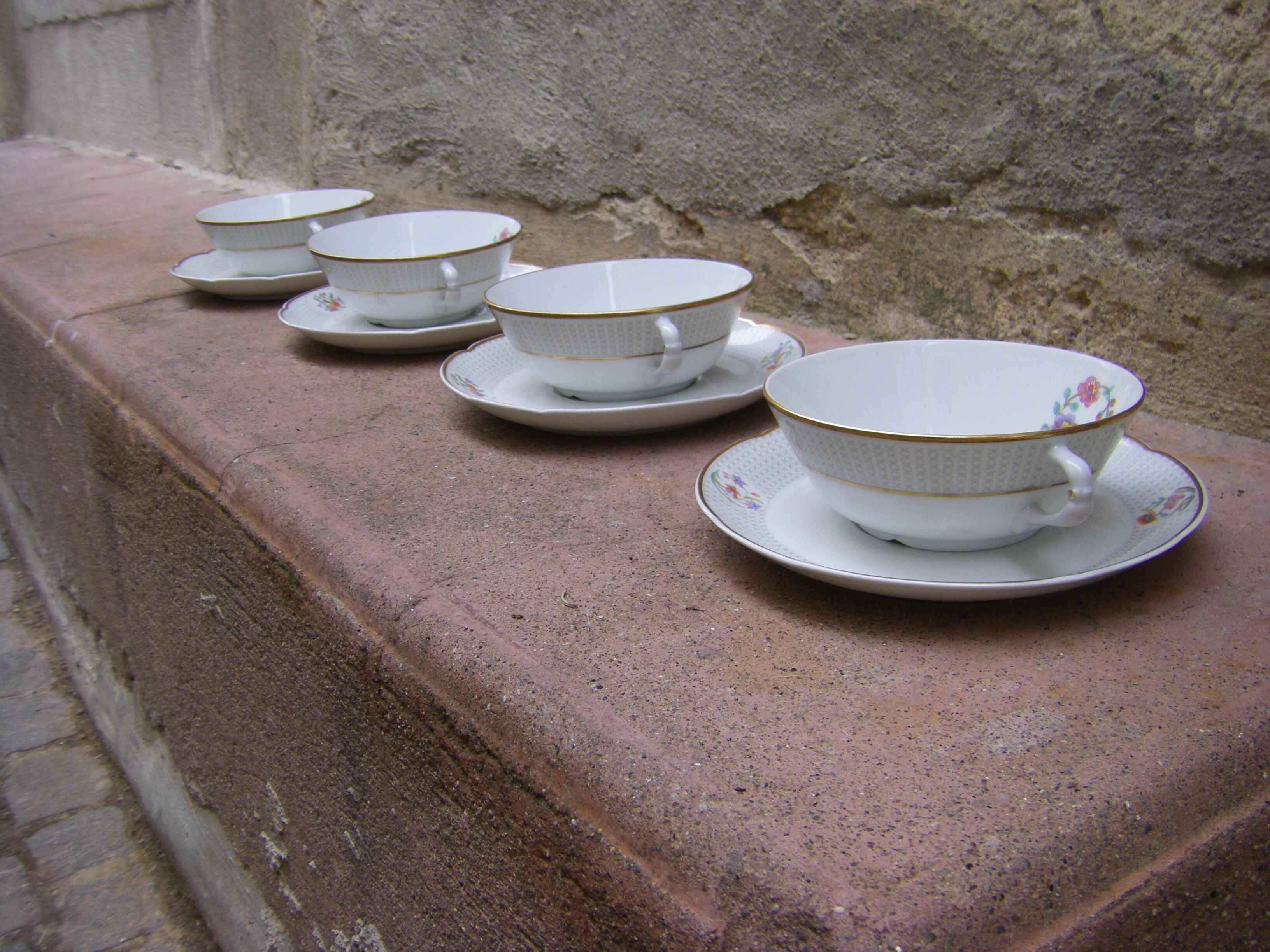Four porcelain tea cups