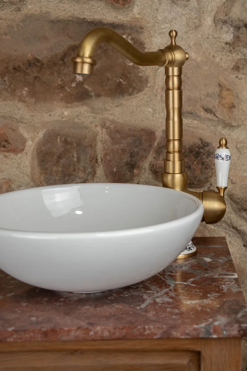 Small antique washbasin in wood and red marble.