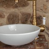 Small antique washbasin in wood and red marble.