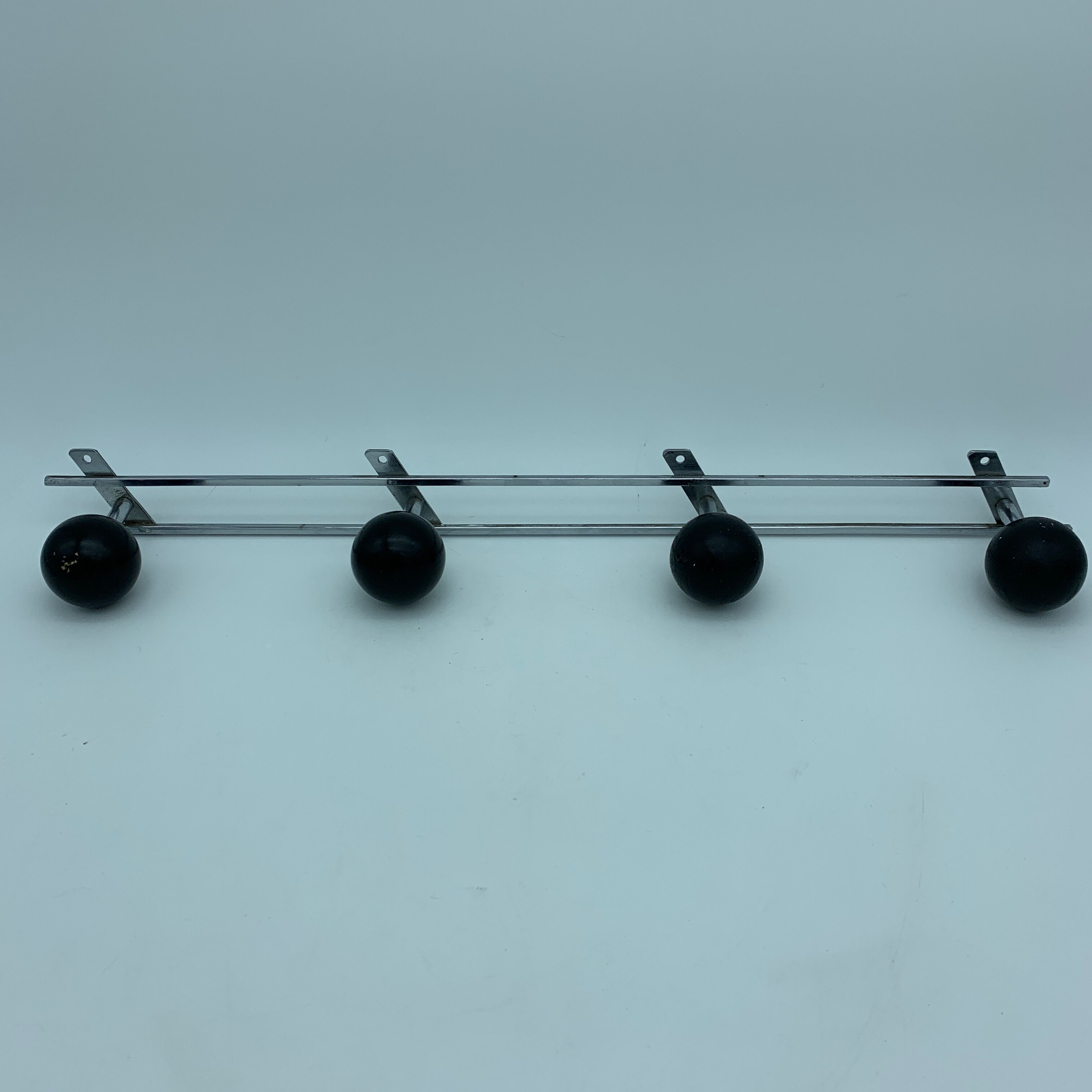 Coat holder 4 chrome steel pateres and black wooden balls