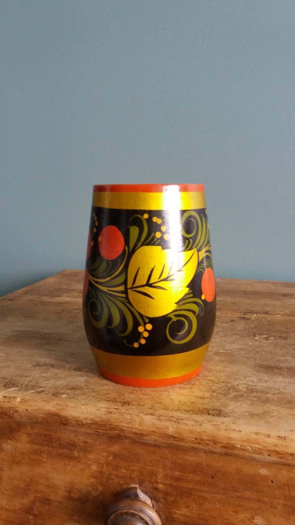 Khokhloma vase, Russian lacquered wood craftsmanship, hand-painted decoration.