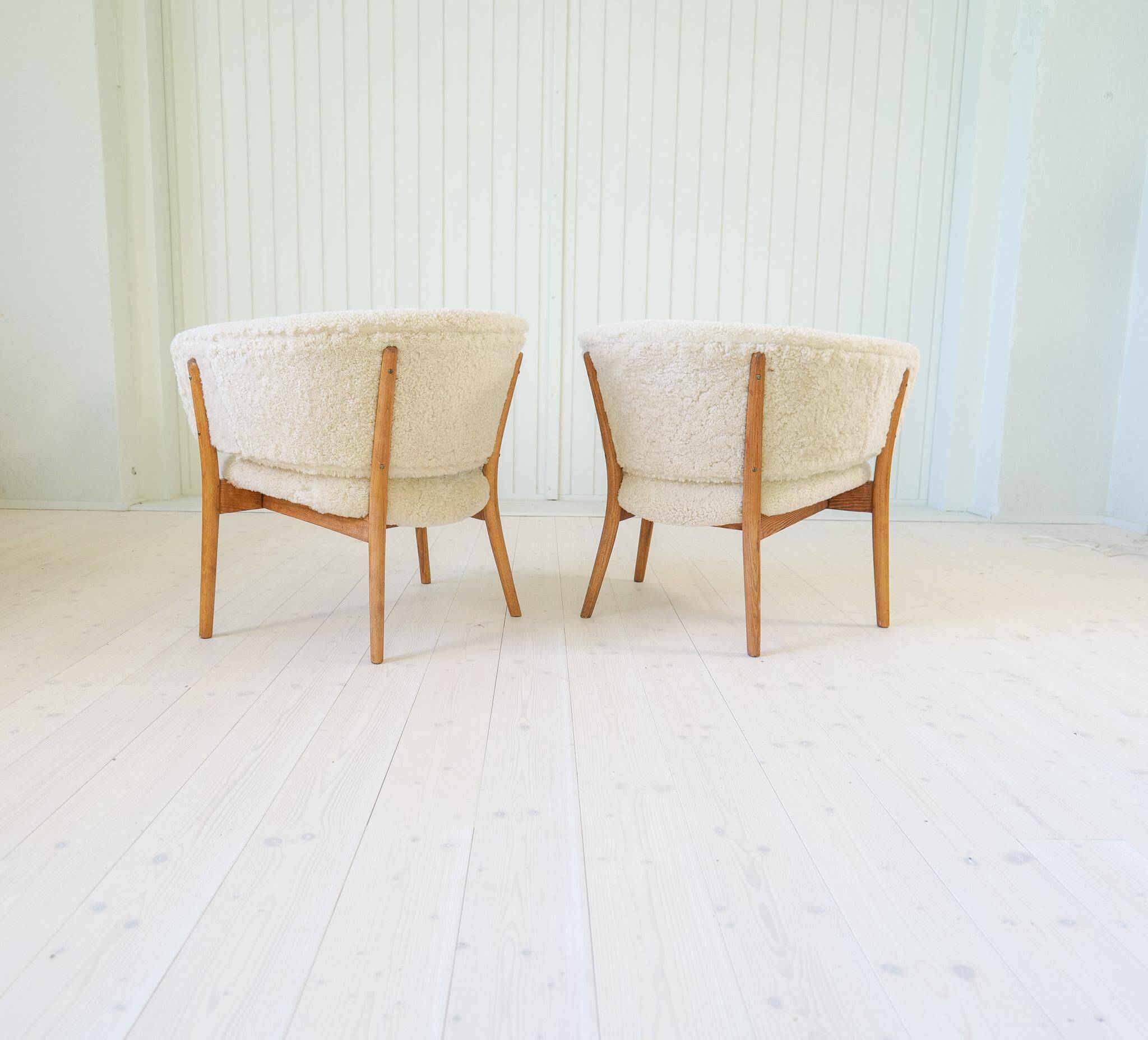 Mid-century lounge chairs in sheepskin/shearling and stained wood, Sweden, 1962.