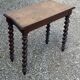 Console in carved solid oak with twisted turned legs, 1890
